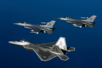 Three F-22A Raptor aircrafts flying in formation poster print.