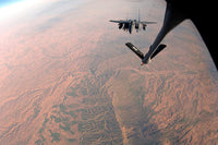 F-15E Strike Eagle being refueled by KC-135 Stratotanker poster print.