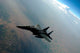F-15E Strike Eagle breaking away from KC-135 Stratotanker during refueling.