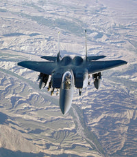 F-15E Strike Eagle soaring over Afghanistan mountains poster print