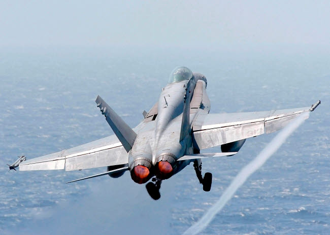 F/A-18 Hornet Taking Off Poster Print by Stocktrek Images