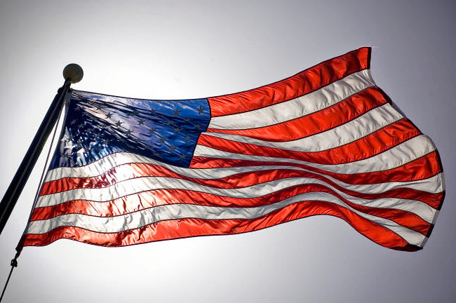 The American Flag Flies Prominently Poster Print