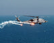U.S. Navy HH-60H Seahawk Helicopter Poster Print dispensing flares and chaff.