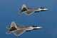 F-22A Raptors flying over Langley Air Force Base, Virginia poster print.