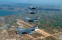 F-16 Fighting Falcons flying in close formation poster print.