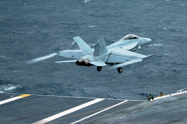 F/A-18F Super Hornet launching from USS Kitty Hawk poster print