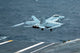 F/A-18F Super Hornet launching from USS Kitty Hawk poster print