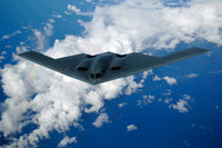 B-2 Spirit Bomber Poster Print by Stocktrek Images, showcasing the stealth aircraft in flight.