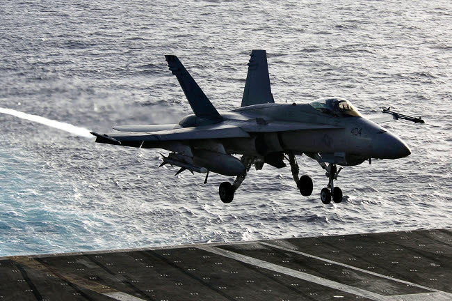 F/A-18C Hornet landing on USS Kitty Hawk poster print