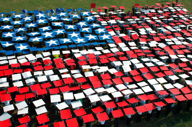 More than 1,200 service members create a human flag poster print