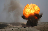 Controlled Demolition of Damaged Ammunition Poster Print by Stocktrek Images.