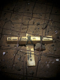 A Road Repair Crew Places a Cross Inside a Road Crater Poster Print showcasing urban life.