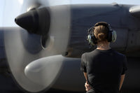 Soldier monitoring C-130 Hercules engine at Camp Lemonnier poster print