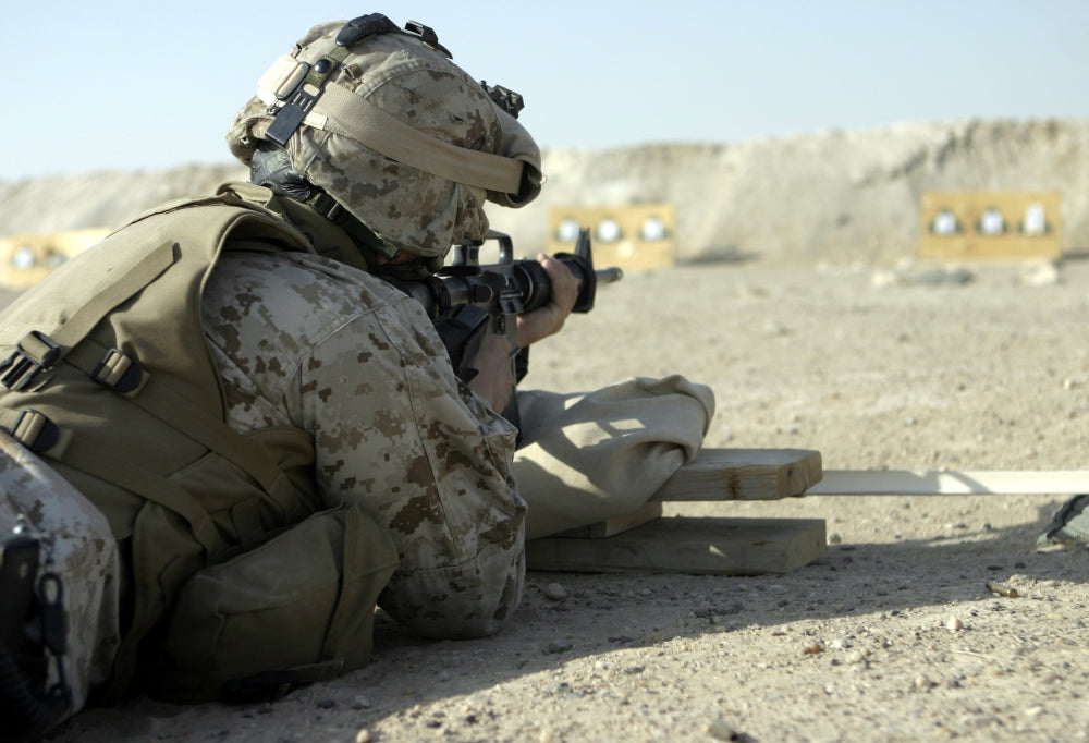 Marine fires M16A2 service rifle at Camp Baharia, Iraq