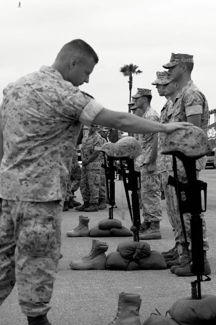 Soldier Pays Tribute to Fallen Marines Poster Print by Stocktrek Images