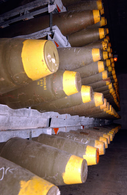Racks of bombs inside a warehouse poster print by Stocktrek Images.