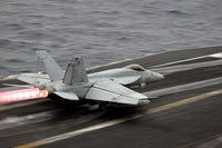 F/A-18E Super Hornet launching from USS Ronald Reagan poster print.