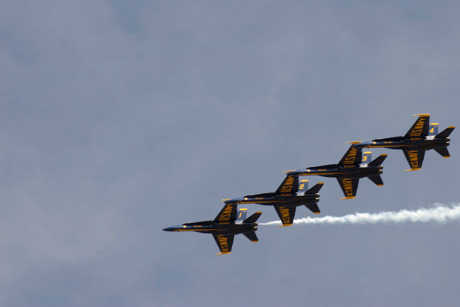 The Blue Angels performing aerial demonstrations poster print by Stocktrek Images.
