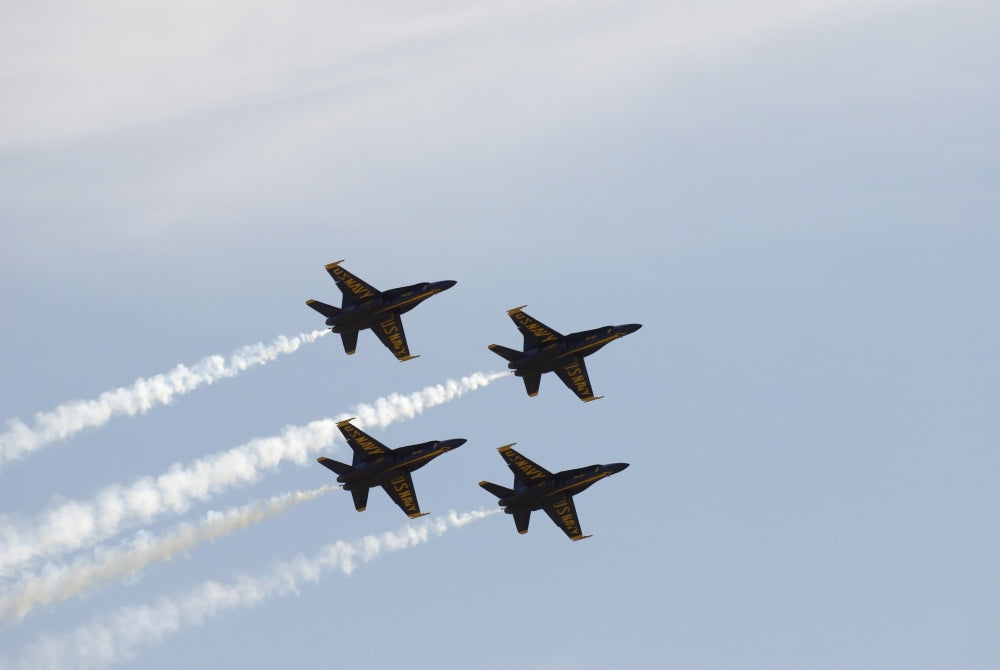 The Blue Angels performing aerial maneuvers in a stunning poster print.
