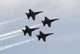 The Blue Angels performing aerial demonstrations at an air show poster print.