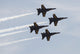 The Blue Angels performing aerial demonstrations during an air show poster print.