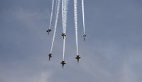 The Blue Angels performing aerial demonstrations in a vibrant poster print.