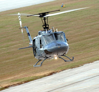 Captain pilots the TH-1H trainer helicopter poster print