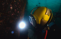 US Navy Diver welding a repair patch on the USS Ogden bow poster print.