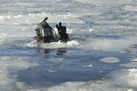 U.S. Navy Diver signals he is okay during a training mission in icy Thames River.