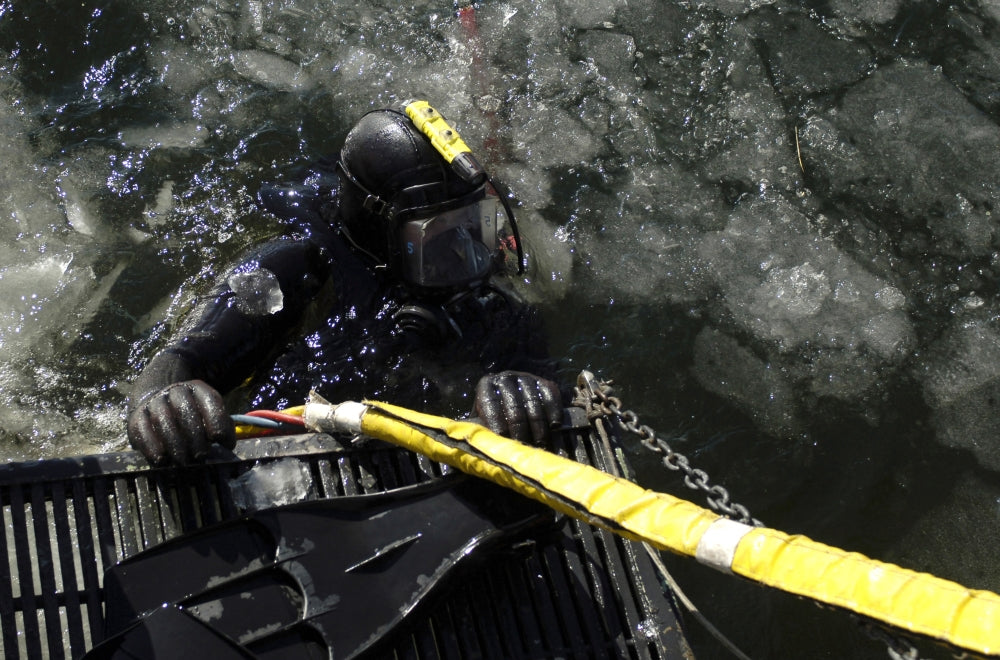 U.S. Navy diver preparing for a dive on the Thames River poster print.