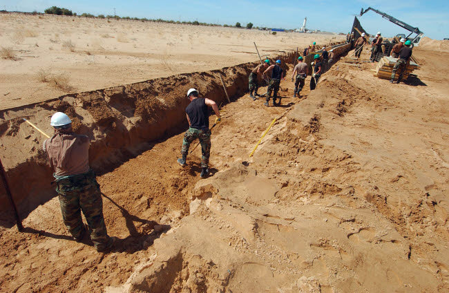 US Air Force Airmen Dig a Trench Poster Print showcasing airmen at work