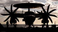 E-2C Hawkeye poster print secured on USS Harry S Truman flight deck.