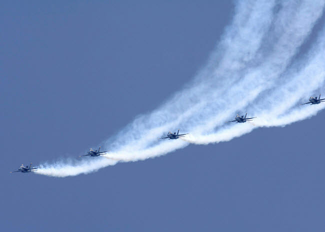 Blue Angels performing a line abreast loop during an air show poster print.