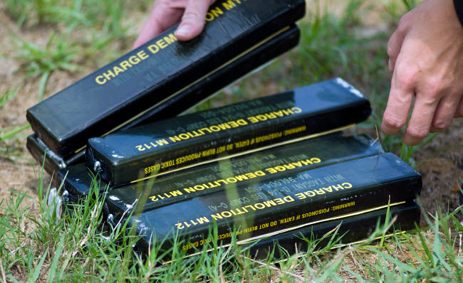 Blocks of Military High-Explosives Poster Print showcasing military engineering and might.