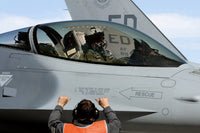 Round personnel prepares to taxi an F-16 Fighting Falcon Poster Print