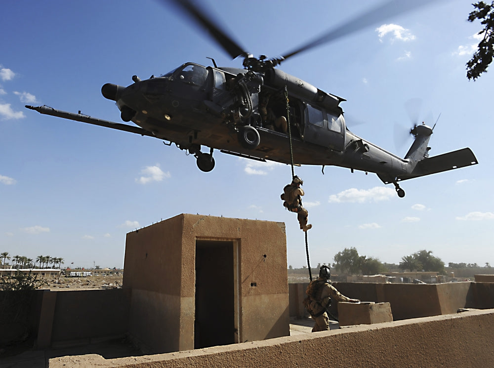 U.S. Air Force Pararescuemen fast roping from HH-60 Pave Hawk helicopter poster print.