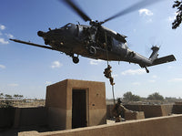 U.S. Air Force Pararescuemen fast roping from HH-60 Pave Hawk helicopter poster print.