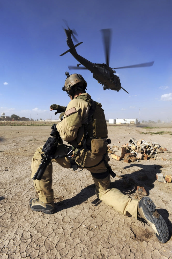 U.S. Air Force Combat Rescue Officer Poster Print depicting HH-60 Pavehawk helicopter training.