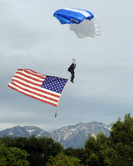Airman Floating through the Sky with American Flag Poster Print