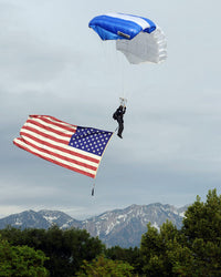 Airman Floating through the Sky with American Flag Poster Print