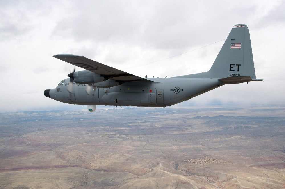 C-130 Hercules soaring through the sky poster print
