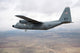 C-130 Hercules soaring through the sky poster print