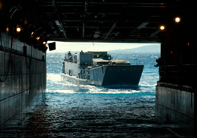 Navy Landing Craft Utility approaching USS Tarawa poster print.