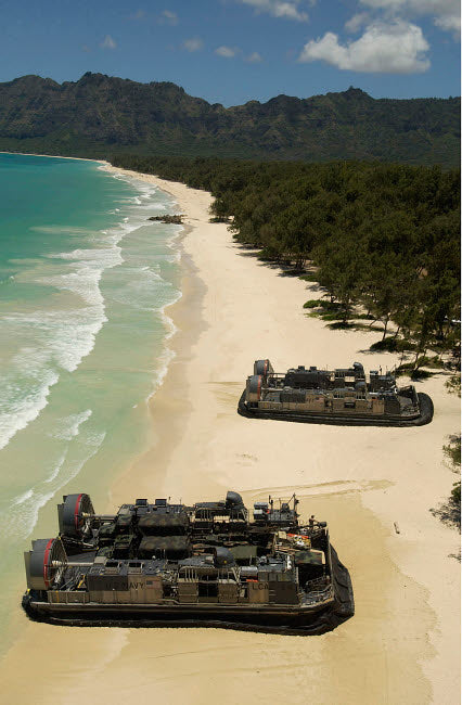 US Navy landing craft offloading equipment on Oahu beach poster print.