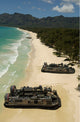 US Navy landing craft offloading equipment on Oahu beach poster print.