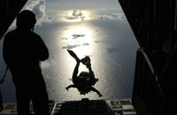 Air Force pararescueman jumping from HC-130 Hercules poster print