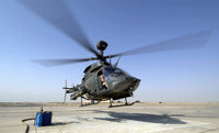 OH-58D Kiowa Warrior helicopter taking off from Forward Operating Base MacKenzie in Iraq poster print.