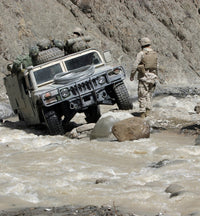 U.S. Marine guiding Humvee through a river in Afghanistan poster print.