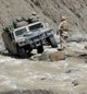 U.S. Marine guiding Humvee through a river in Afghanistan poster print.