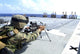 U.S. Marine adjusting weapon during live-fire exercise on USS Harpers Ferry.